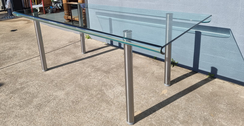 Striking and distinctive Vintage FIAM Italia Designer curved edge glass desk. FIAM was founded in 1973 by Vittorio Livio and has become synonymous with glass culture in Italy and the World. FIAM is still manufacturing today, in collaboration with various Designers, and has won numerous awards and is represented in various international museums. 
Condition: Evidence of use with minor scratches to the surface and a small chip that has been repaired. Overall, in very good condition with one repaired chip to t