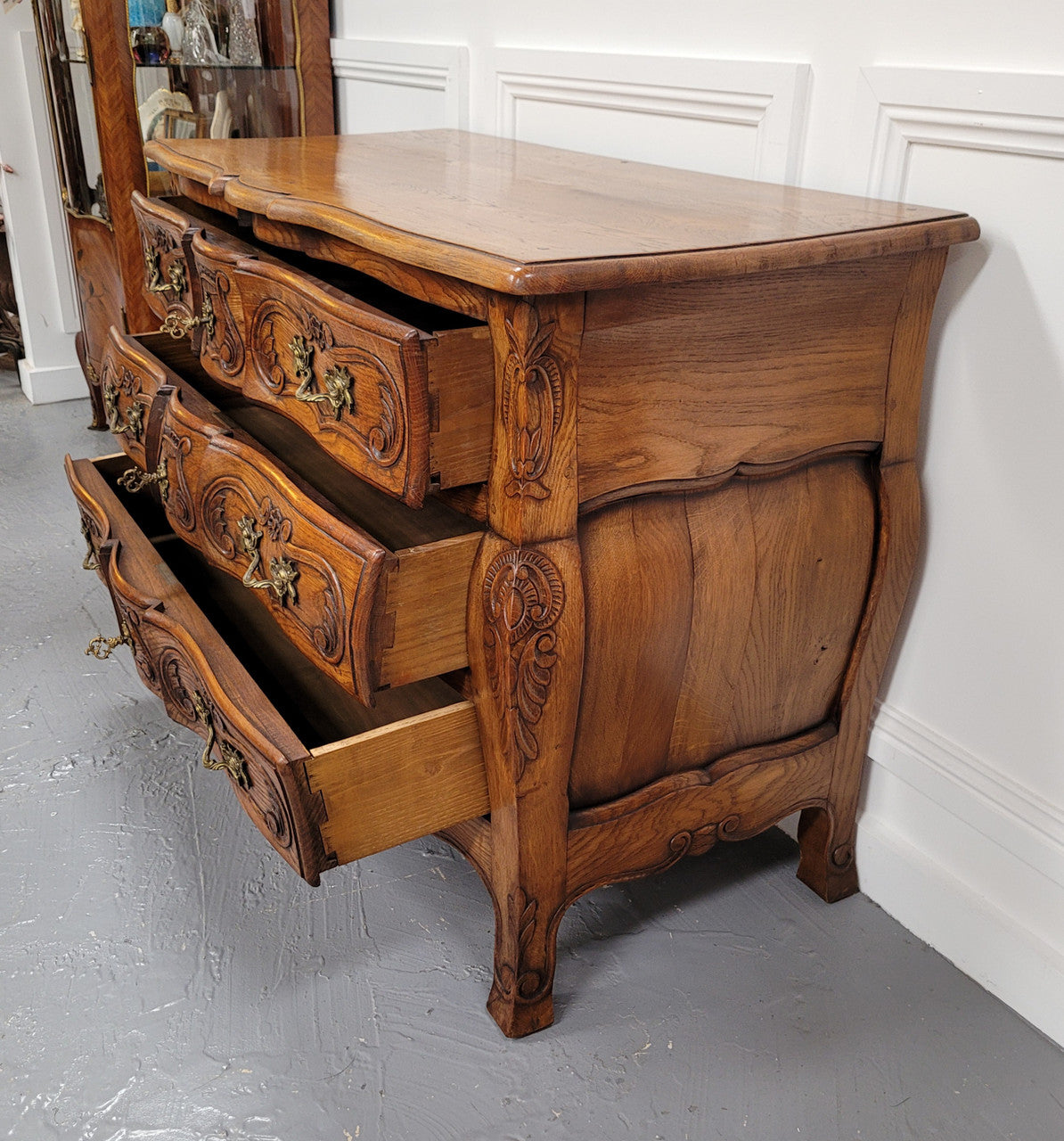 French Antique Louis XIV style Oak wooden top commode. It has a stunning serpentine bombe shape front along with amazing handles and carvings. It comes with three beautiful keys as pictured and comes with working locks. It has been sourced from France and in good original detailed condition.