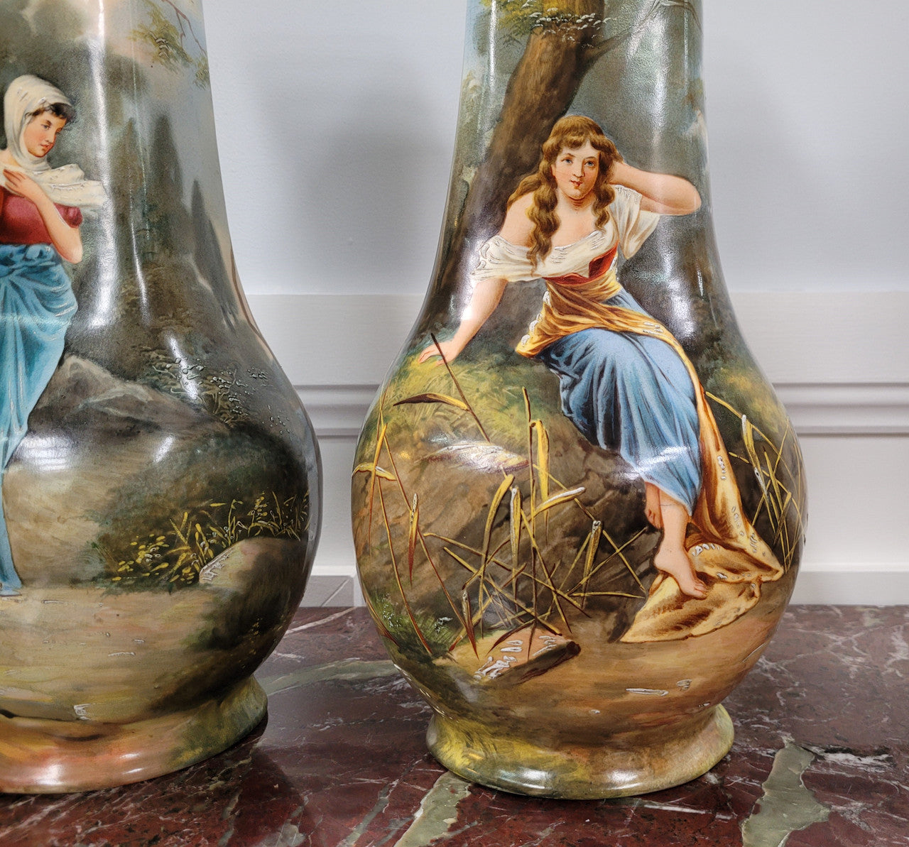 Pair of Victorian hand painted decorative vases depicting women. Please view photos as they help form part of the description.