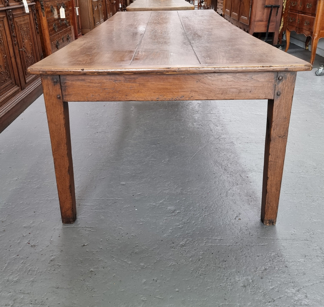 Amazing 19th Century French Oak Farmhouse Style Dining Table with three drawers. It is made from 3 large planks of wood which is very hard to find. 105.5 cm wide.