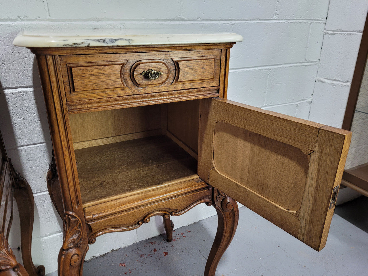 Pair of Louis XV style bedside cabinets with beautiful marble tops and one drawer and single cupboard for all your storage needs. In good original detailed condition.