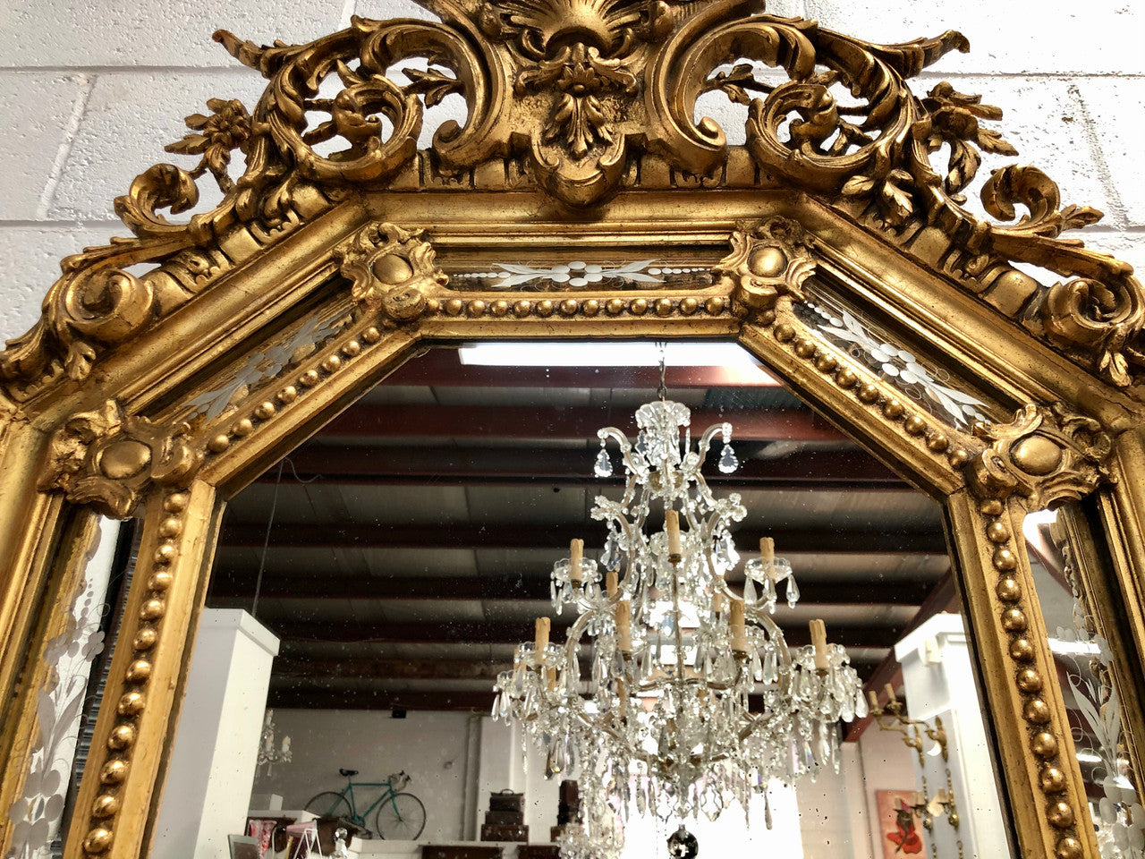 Early 19th Century gilt cushion mirror with acid etched floral pattern. In good condition. Please note original mirror does show some spotting commensurate with its age. Circa