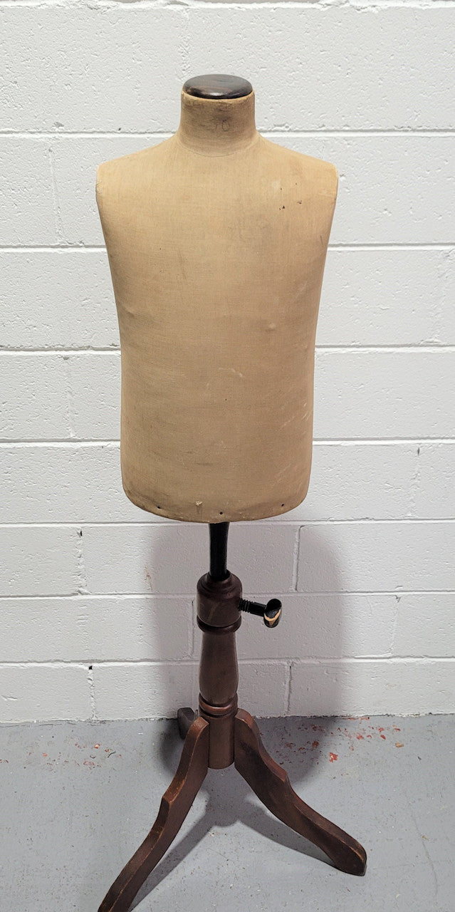Vintage fabric covered child mannequin on adjustable wooden base. In good original condition.