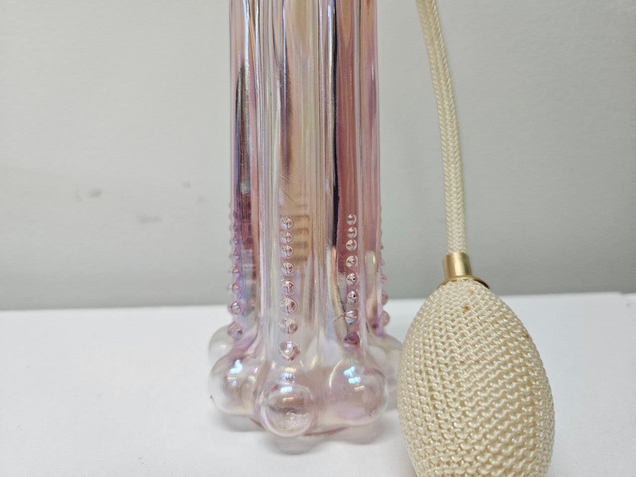 Vintage Fenton, Pink/Purple iridescent perfume bottle, cased glass, beaded base with working atomiser. Clearly marked FENTON on the base with original paper label.