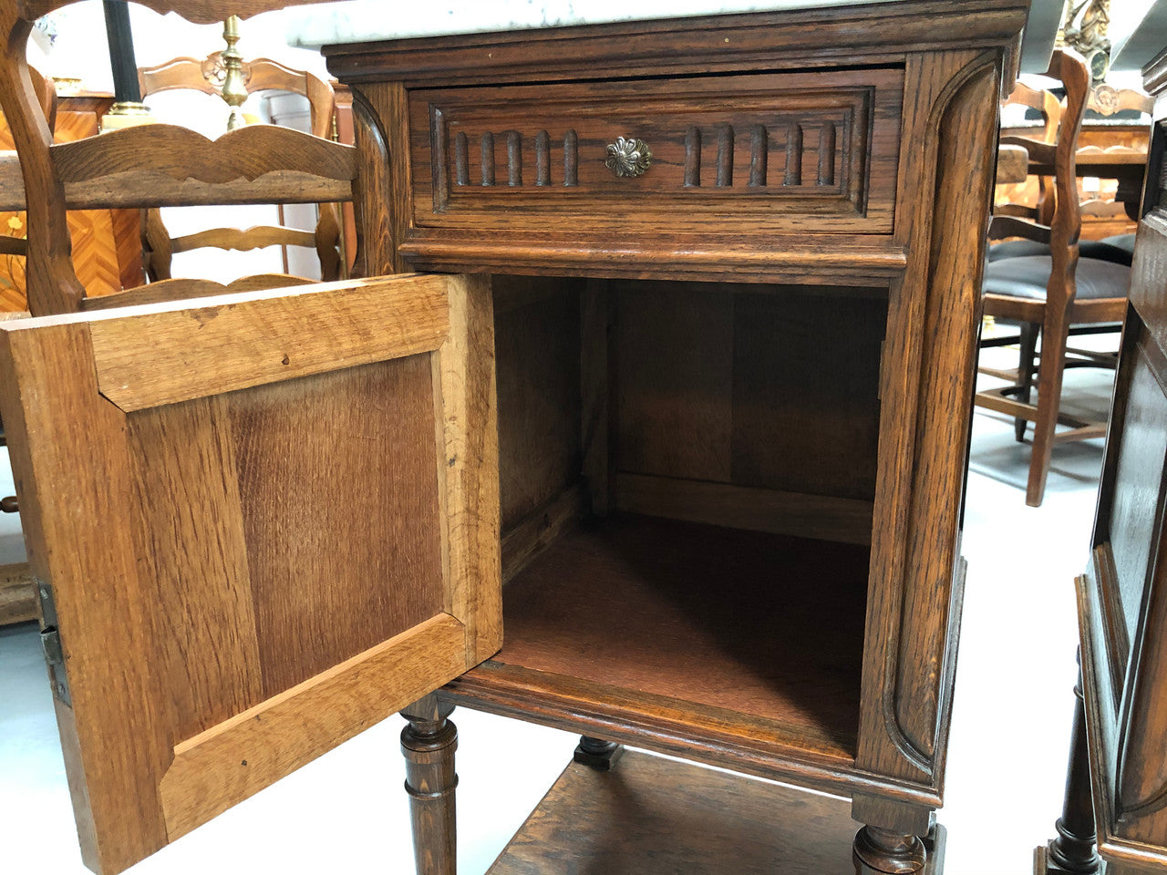 A french oak pair of carved bedside cabinets, with lovely detail and nice coloured marble tops and plenty of storage space. In good condition.