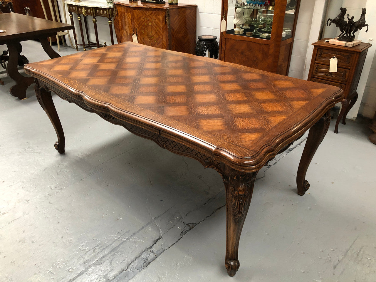 High quality French Oak Louis XV Style, beautifully carved extension table. It has an amazing parquetry top and when fully extended measures to 3 meters long. In very good original detailed condition.