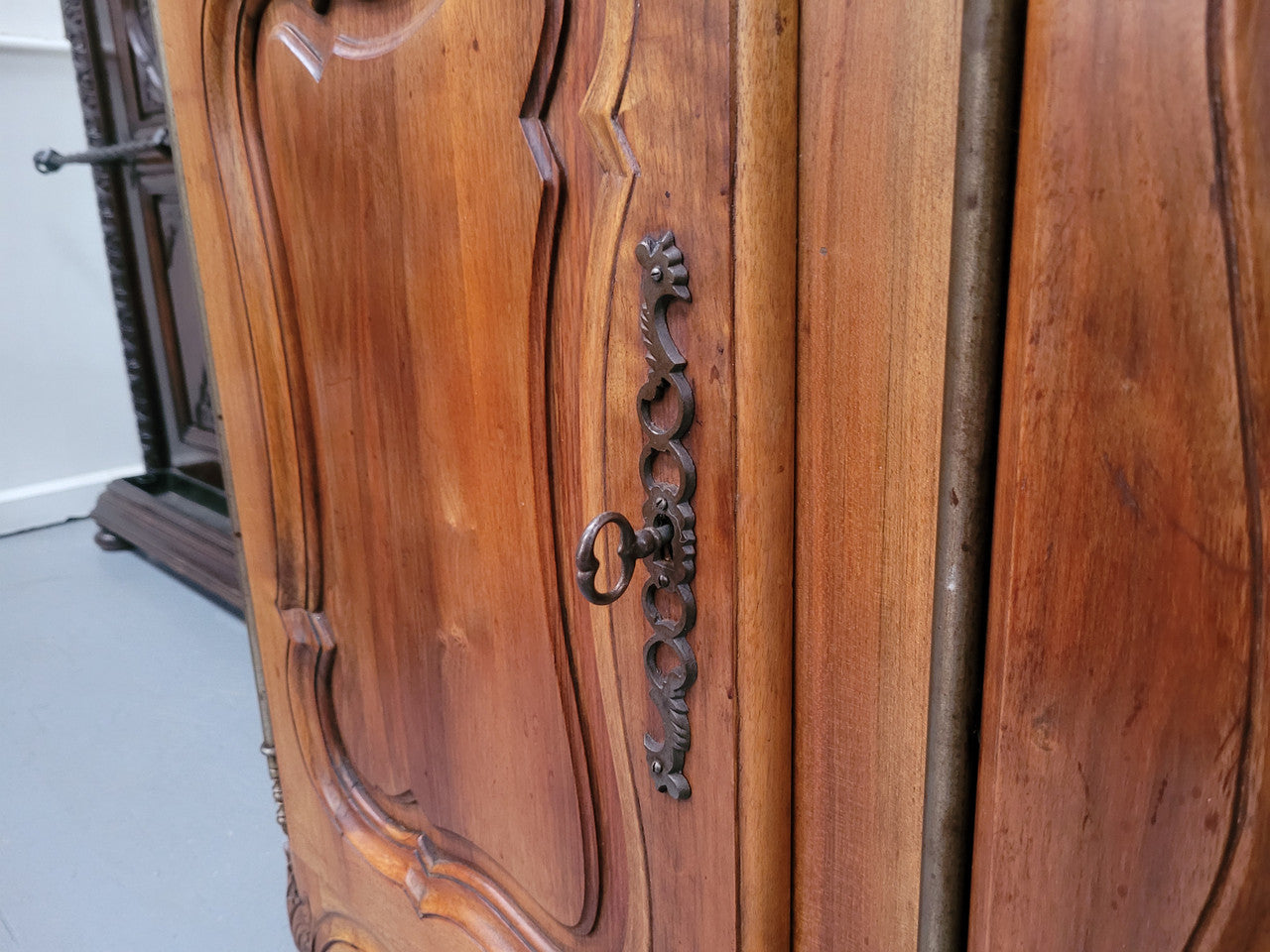 Magnificent French Walnut two-body four door display cabinet. Heaps of storage space with four glass doors at the top with shelves and four solid doors below also with shelving. It has been sourced from France and comes with a key for each door and all are lockable. In good original detailed condition.