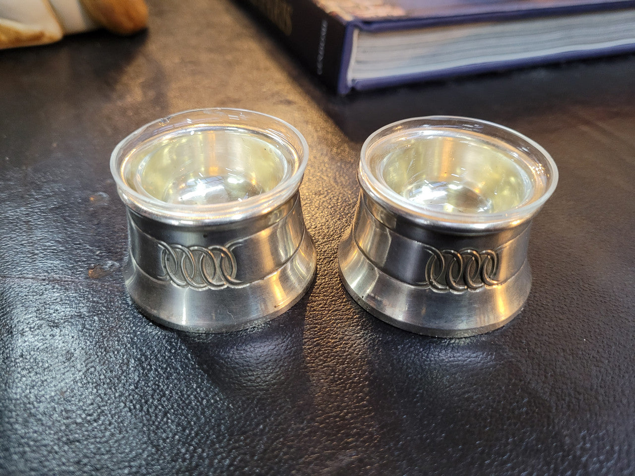 Pair antique silver salt cellars with liners. Stamped “800” 80g. 4.5cm Diam & 3cm Height. In good condition please view photos as they help form part of the description.