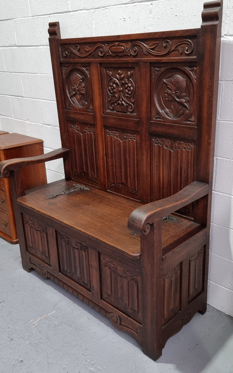Decorative and nicely carved French Oak 19th Century hall seat with lift up lid for storage. Beautiful details and in good original detailed condition.