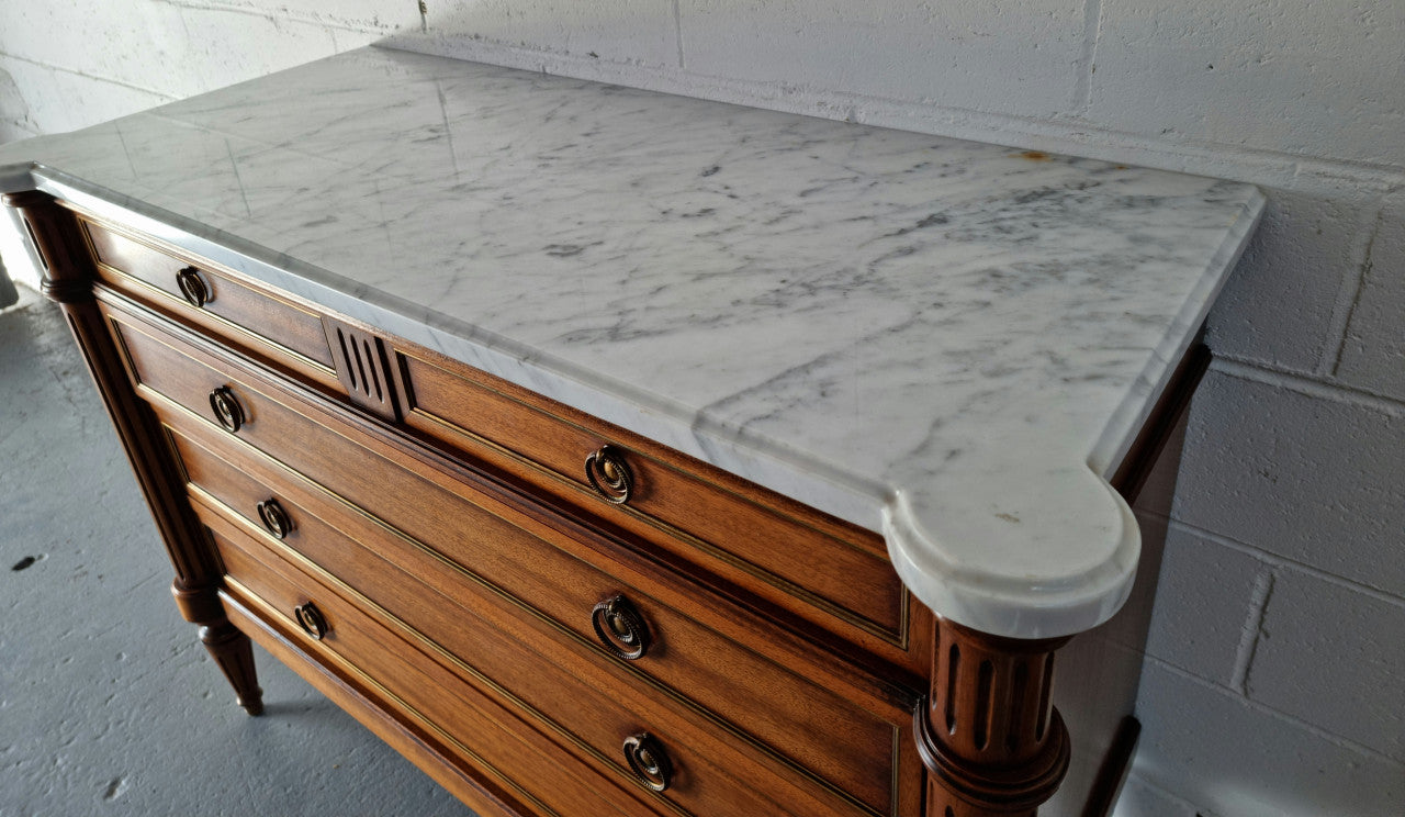 Beautiful French Louis XV Style Marble top five drawer commode. There are five drawers and it has a lovely brass inlay. It is in good original detailed condition.