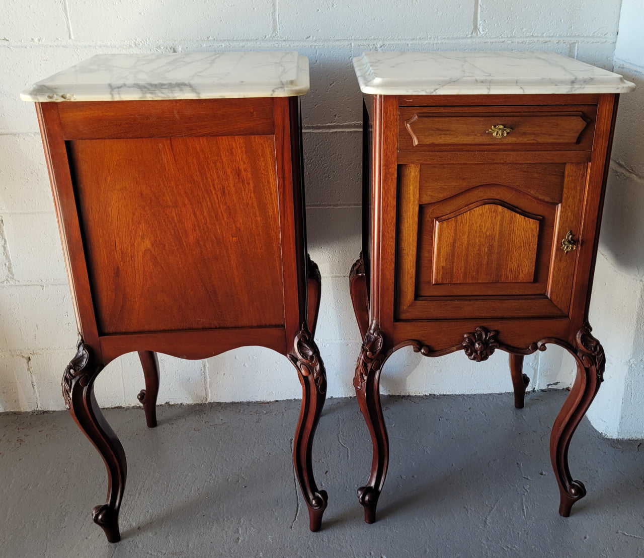 Pair of Louis XV style Walnut bedside cabinets marble top. Circa 1900 and in good original detailed condition.