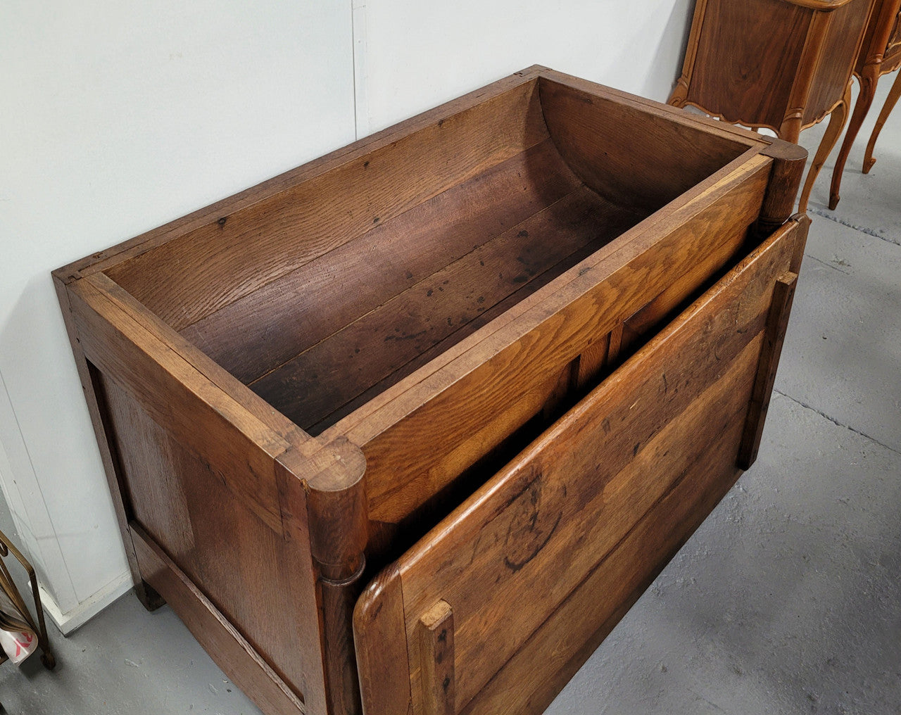 French 19th Century Oak dough bin buffet. The heavy solid top lifts upto reveal a half barrel compartment where traditionally flour and yeast were poured, mixed and proofed to grow into a nice dough.
Although originally intended for dough this would make an ideally TV cabinet with the two doors opening with plenty of storage.
