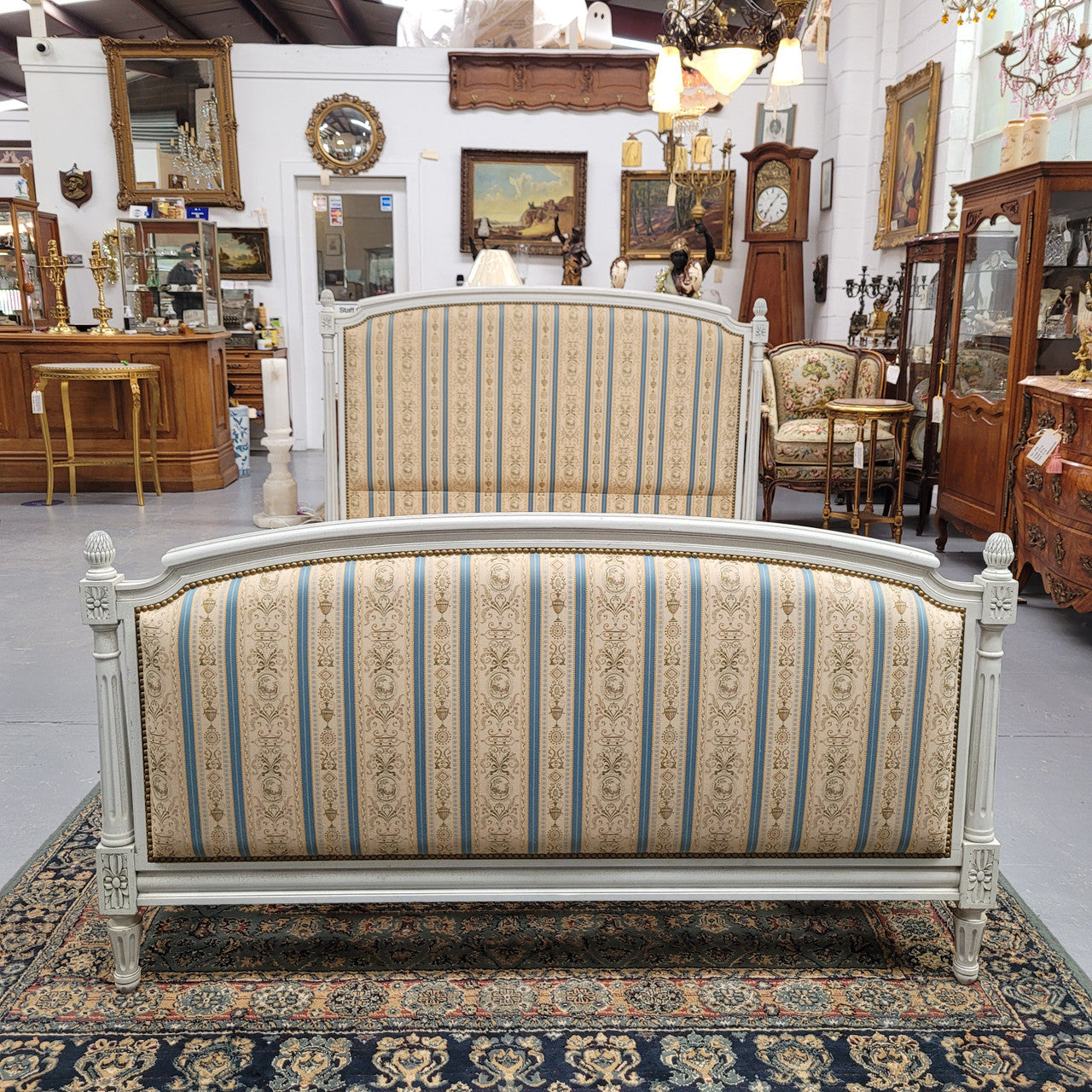 French Louis 16th style double bed and rails with original crackle paint. It also has good quality upholstery. Bed comes complete with custom made slats. Just place your mattress on top. Sourced from France and in good original detailed condition.