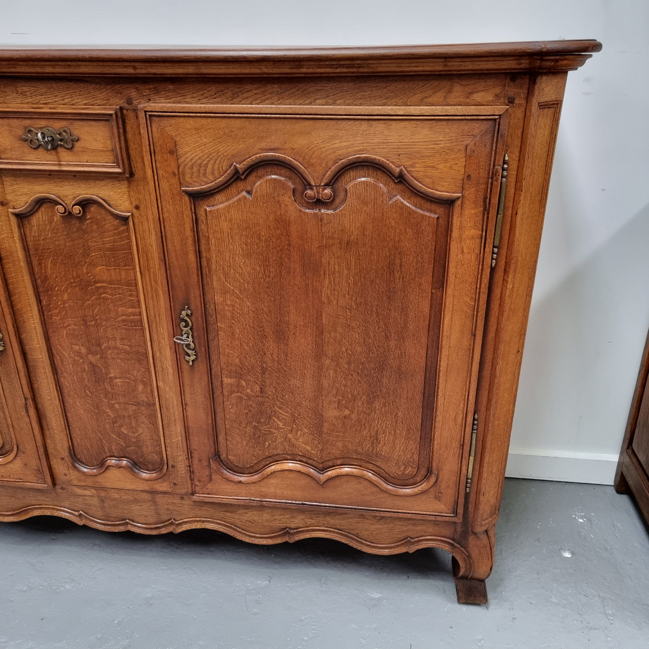 Amazing French Oak early 19th Century two door sideboard with one drawer and two fixed shelves. Sourced from France and in good original detailed condition.