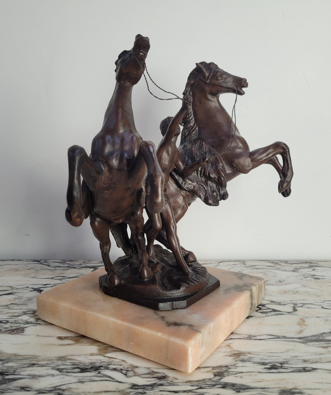 French Art Deco cold painted bronze metal marley horses style statue on a marble base. It is in good condition.