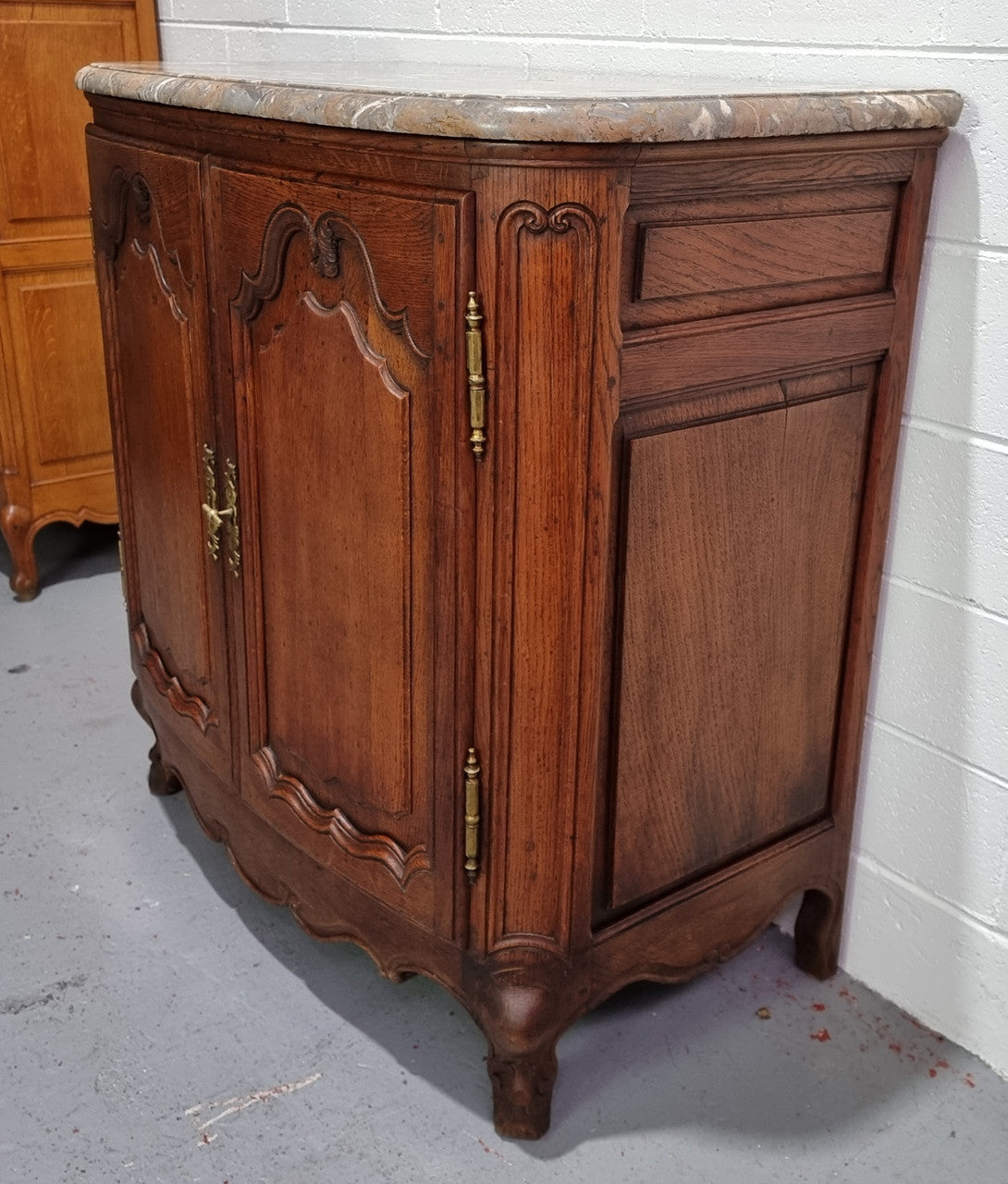 Rare 19th Century French Oak and marble top oval buffet / cabinet. Stunning thick marble top and decorative handles. In good original detailed condition.