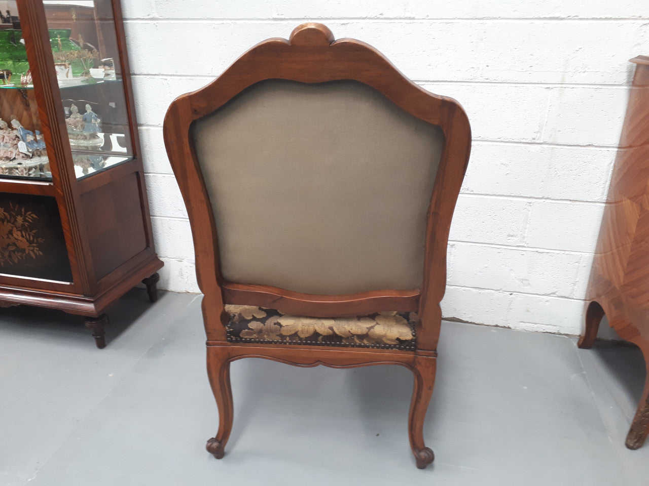 Pair of 19th Century French walnut tapestry covered arm chairs. They are in good original condition. Circa 1890.