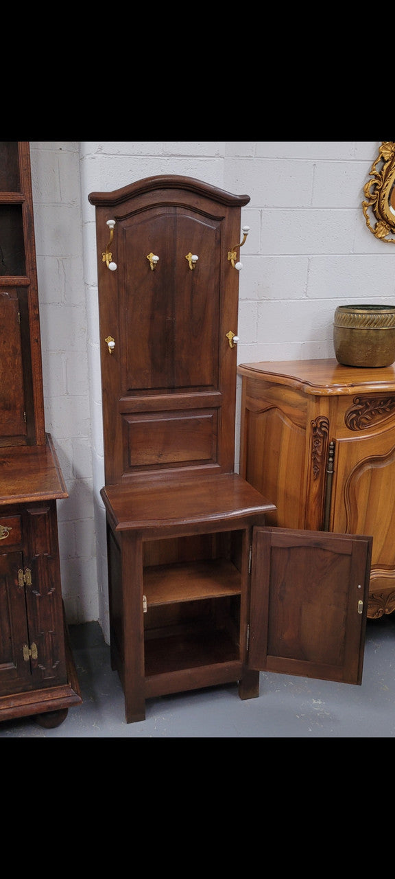 Lovely entrance piece with shelf and single door cupboard, topped with a section for hanging jackets, hats etc. Sourced from France and in good original detailed condition.