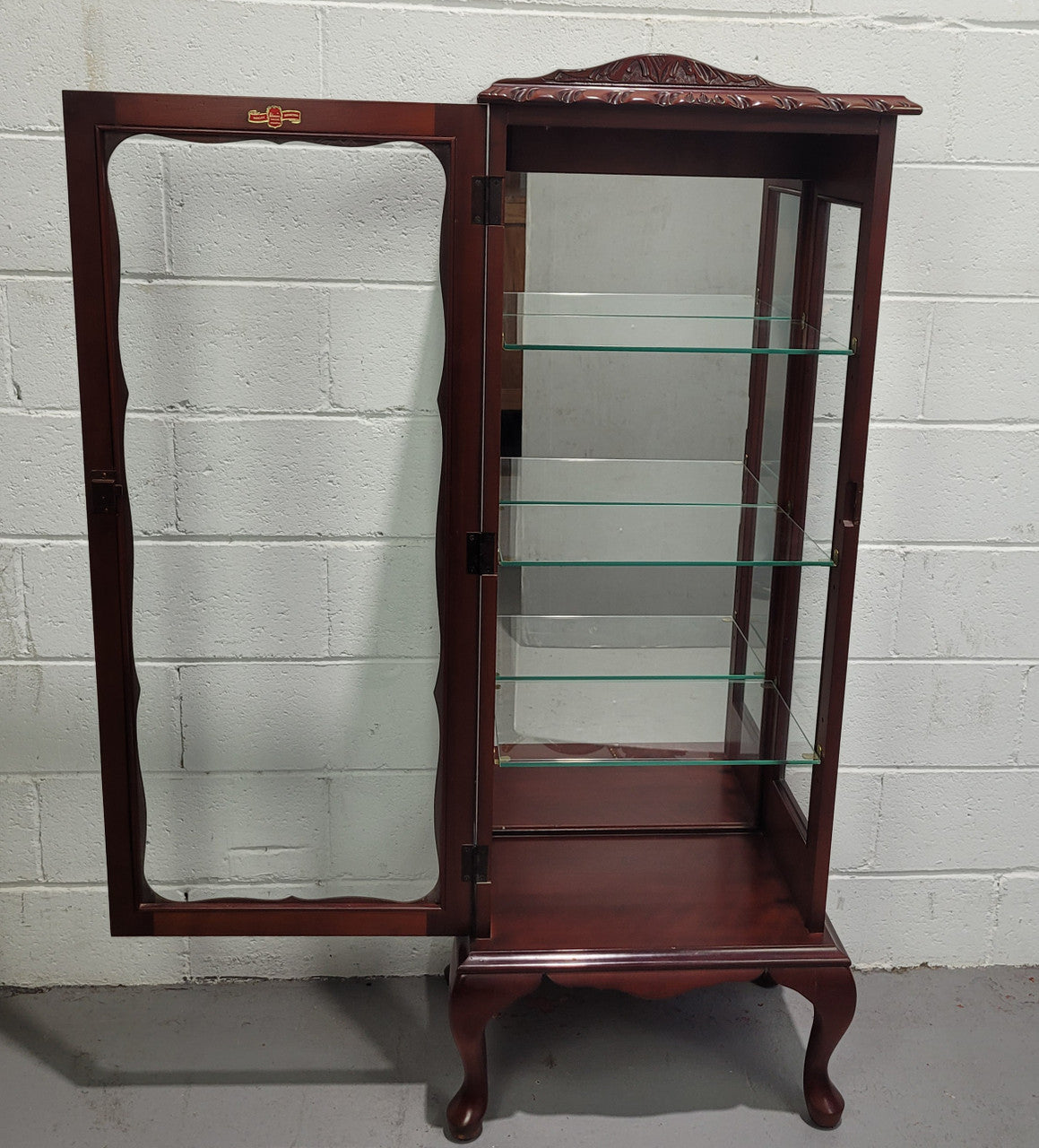 Vintage Mahogany petite display cabinet with three solid glass shelves. Ideal for a small area and is in good original detailed condition.