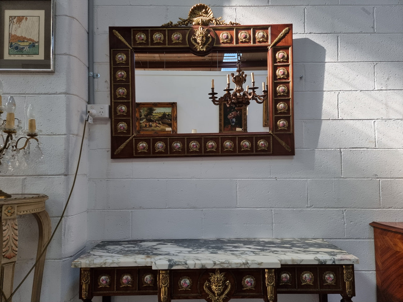 Vintage Mahogany marble top console table with matching mirror. Both with inset limoge panels surrounded by gilt brass. Highly decorative and in good original detailed condition. Circa 1950.