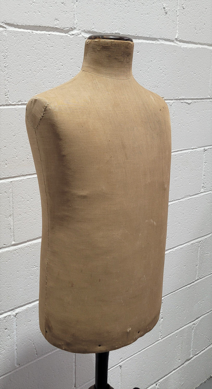 Vintage fabric covered child mannequin on adjustable wooden base. In good original condition.