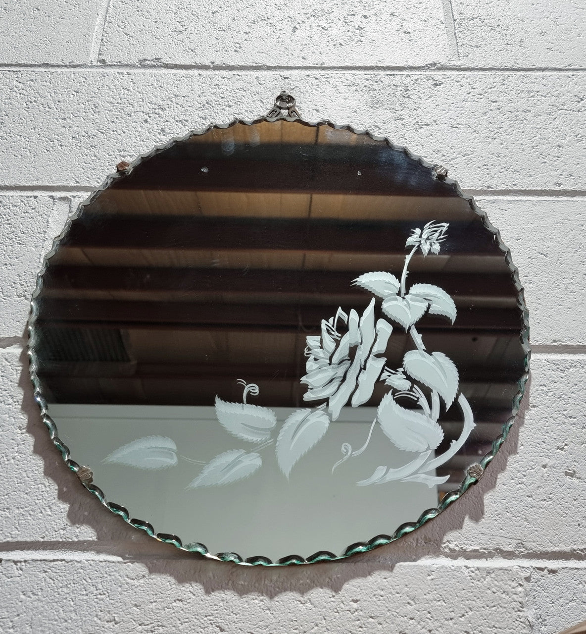 Vintage Art Deco round wall mirror with pie crust edge and etched floral design . In good condition, please see photos .