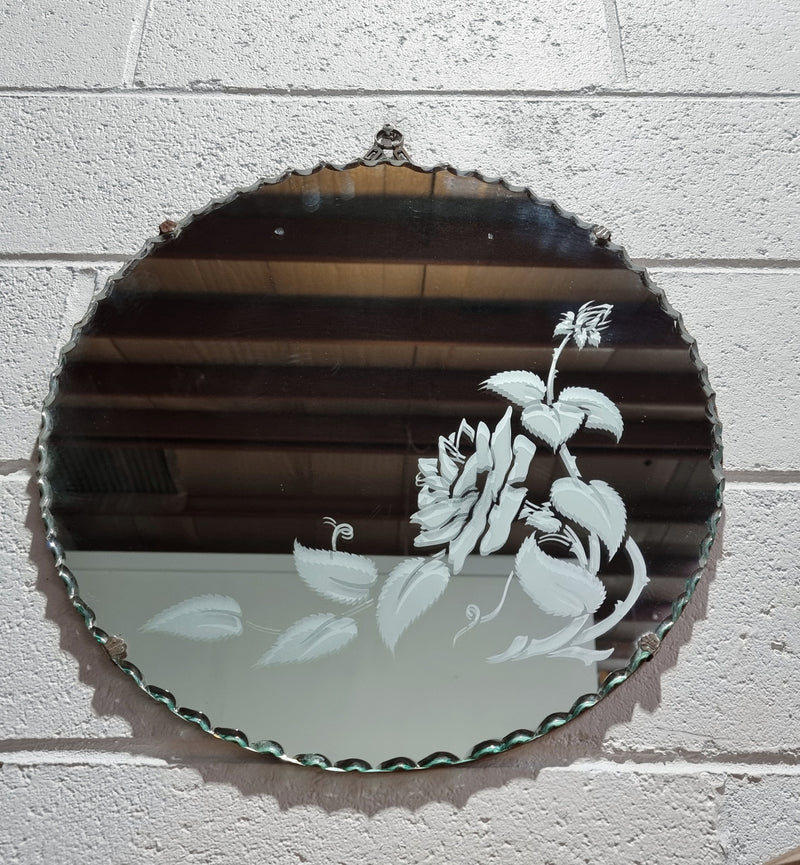 Vintage Art Deco round wall mirror with pie crust edge and etched floral design . In good condition, please see photos .