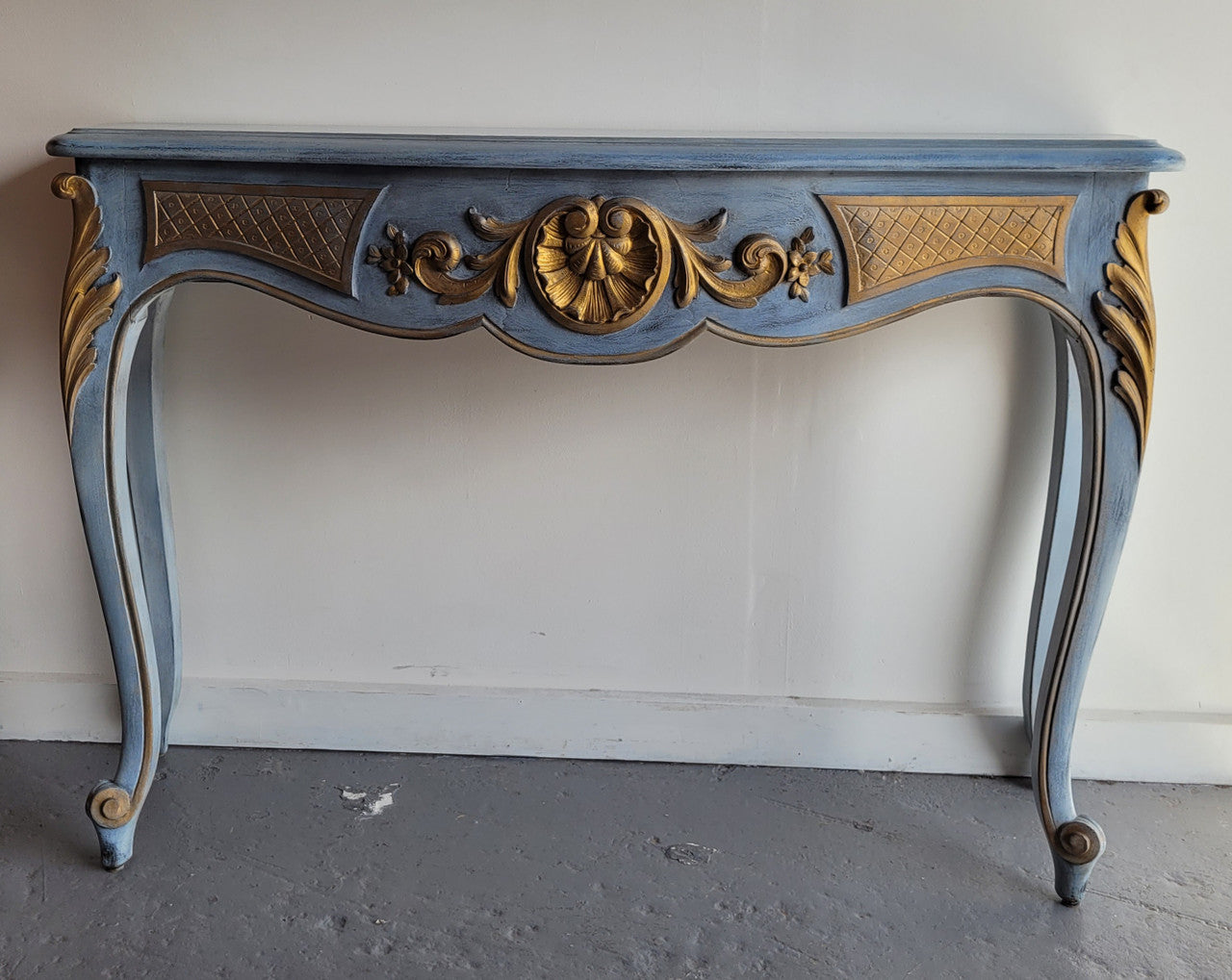 Stylish Louis 15th style console table with chalk paint and gilded highlights. They have been sourced from France and is in good original condition.