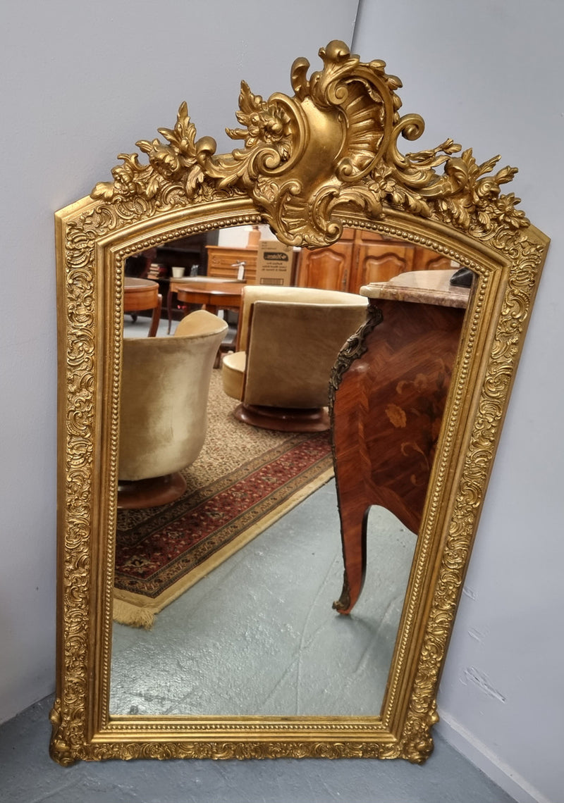 Late 19th Century French Louis XV style carved gilt wall mirror. Sourced from France and in good original detailed condition.