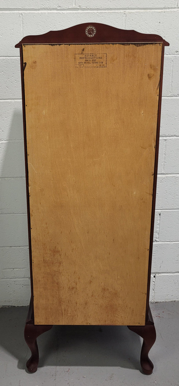 Vintage Mahogany petite display cabinet with three solid glass shelves. Ideal for a small area and is in good original detailed condition.