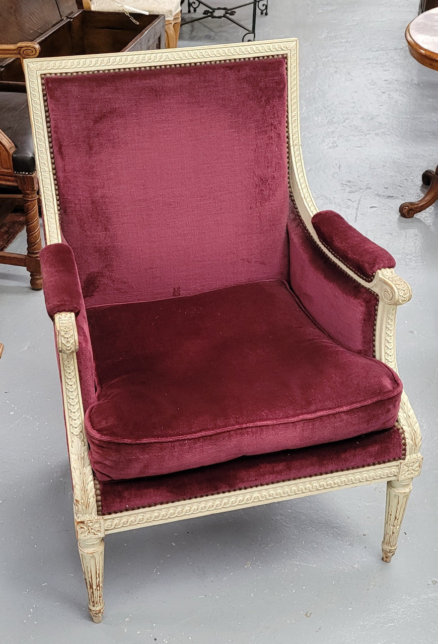 Louis 16th Style high back upholstered chair with maroon velvet fabric, decorative carvings and original paint. It has been sourced from France and in good original condition.