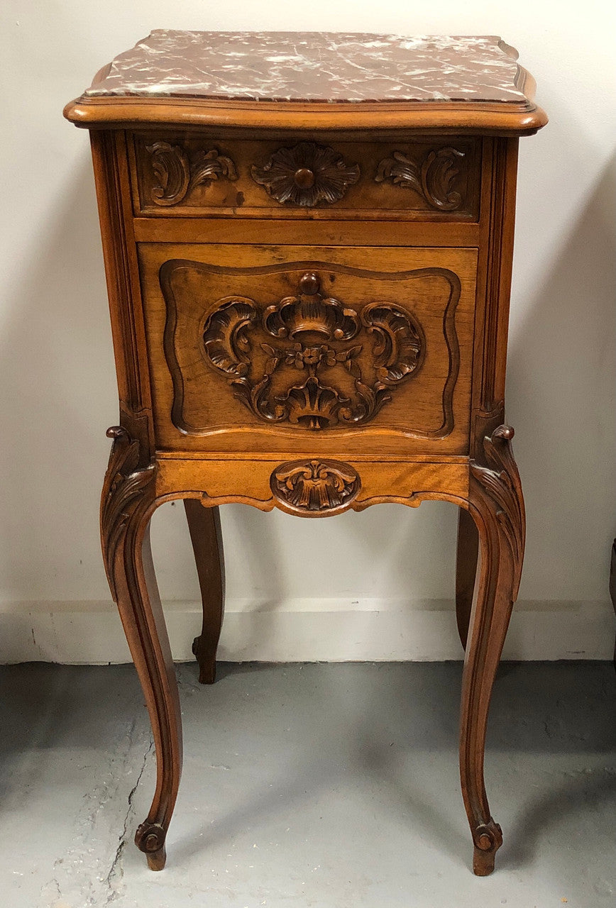 Single French carved bedside with inset marble top. It has beautiful carving and a drawer and cupboard for storage. In very good original detailed condition.