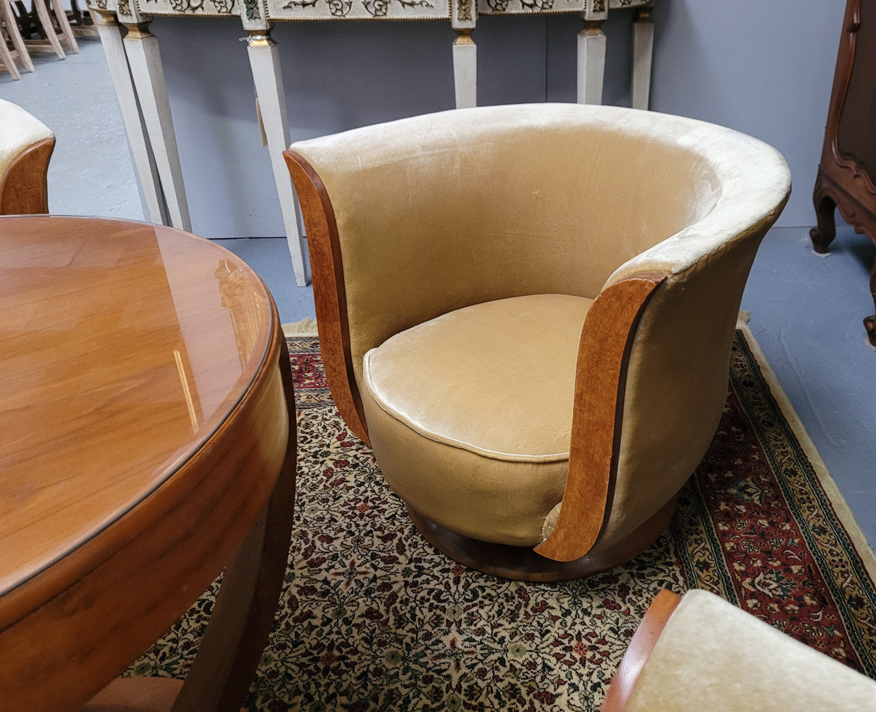 Four stunning original Art Deco Tulip shaped salon lounge chairs made specifically for the Hotel Le Malandre, Belgium in the 1930’s. They are marked with a metal tag “Hotel Le Malandre Modele Depose” Burl Walnut, Walnut and gold coloured velvet upholstery and rest on a thick wooden circular base it has been sourced in France and in good original condition. Included in the set is the accompanying Art Deco Walnut with glass top side table also made for Hotel Le Malandre and marked with the metal tag. Absol
