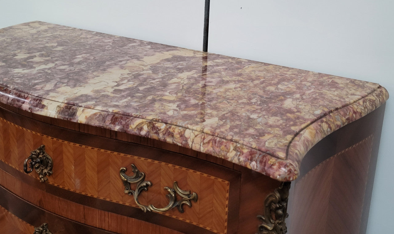 Walnut Louis XV style marble top abbattant with beautiful parquetry inlay and ormolu mounts. It has plenty of storage space with four large drawers and four smaller internal drawers. Beautiful drop down desk with a leather insert. In very good original detailed condition.