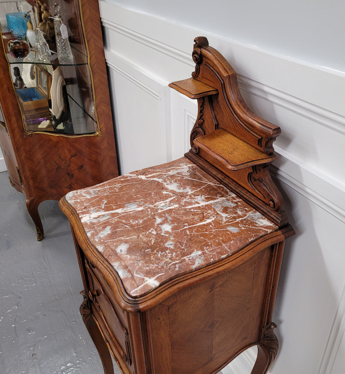 French Louis XV style Walnut single bedside cupboard with inset marble top. It has been sourced from France and is in good original detailed condition.