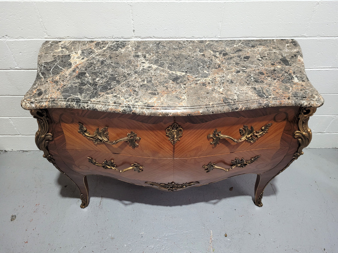Stunning French Walnut and Rosewood Louis XV style two drawer commode with a beautiful marble top and ormolu mounts. In good original detailed condition.