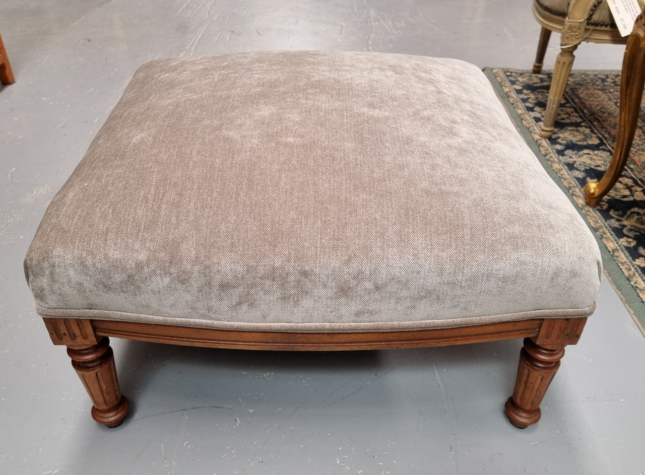 Lovely French Louis 16th style large walnut footstool with light grey upholstery. Circa:1900. In good detailed condition.