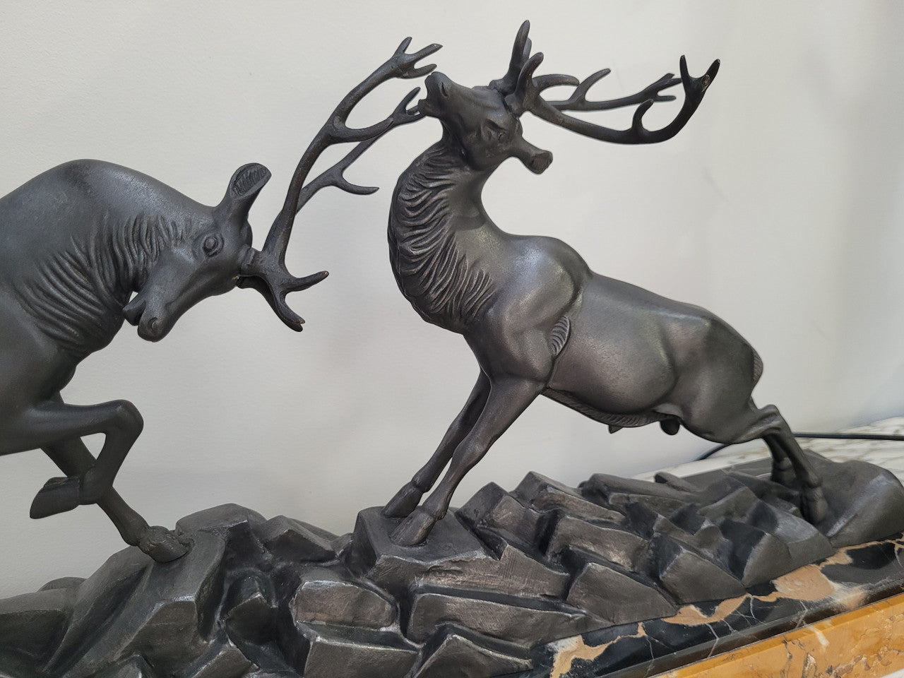 French Art Deco bronzed spelter and marble"Fighting Stags" statue by renowned artist and sculptor "Irenee Rochard".
