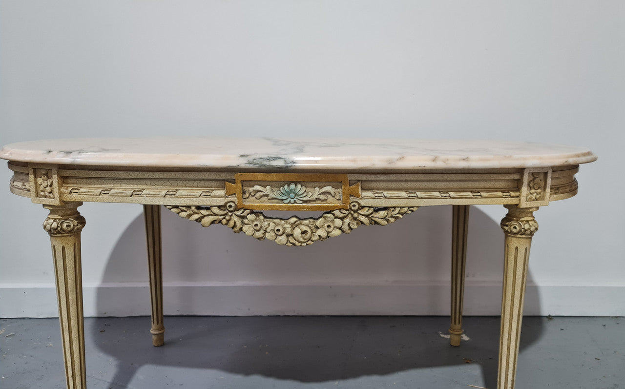 Charming painted Louis XVI style oval marble top coffee table. In good original detailed condition.