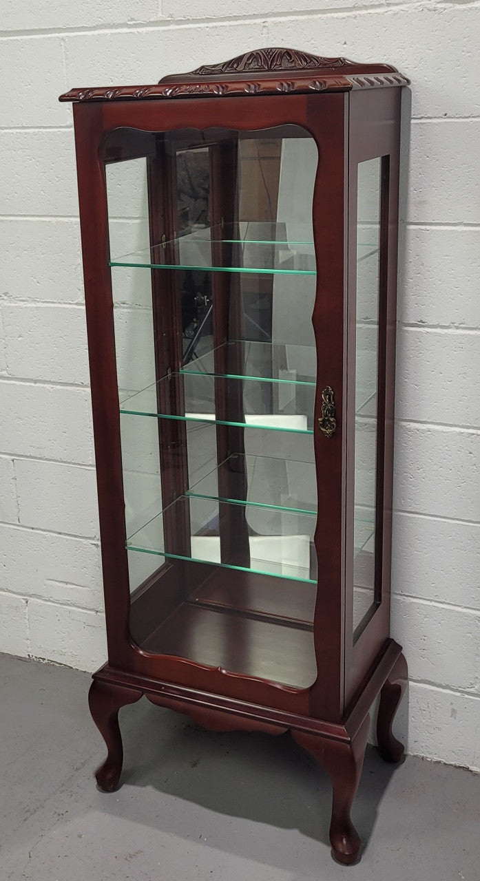 Vintage Mahogany petite display cabinet with three solid glass shelves. Ideal for a small area and is in good original detailed condition.