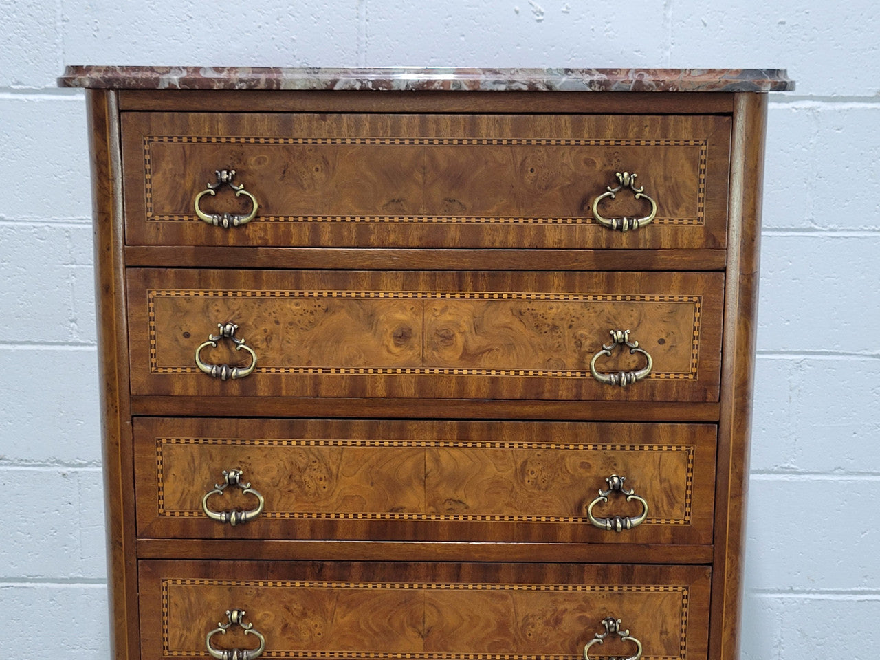 Louis XV style parquetry inlaid marble top semainier. It has seven drawers and a stunning coloured marble top. In good original condition.