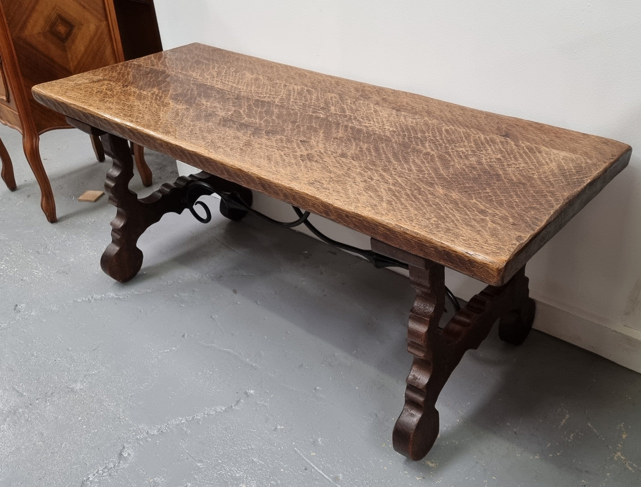 Charming French rustic Spanish style coffee table. It has an amazing rustic top and beautiful iron work. Sourced from France and is in good original detailed condition.