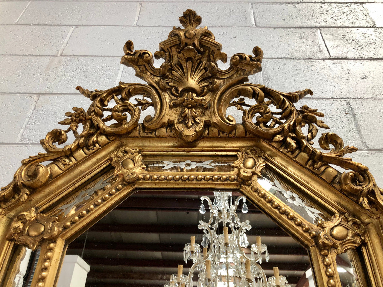 Early 19th Century gilt cushion mirror with acid etched floral pattern. In good condition. Please note original mirror does show some spotting commensurate with its age. Circa