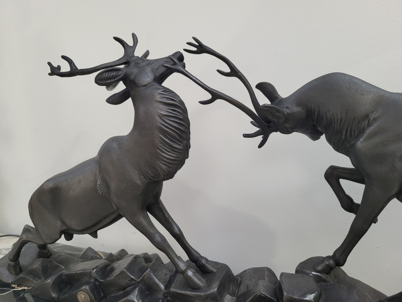 French Art Deco bronzed spelter and marble"Fighting Stags" statue by renowned artist and sculptor "Irenee Rochard".