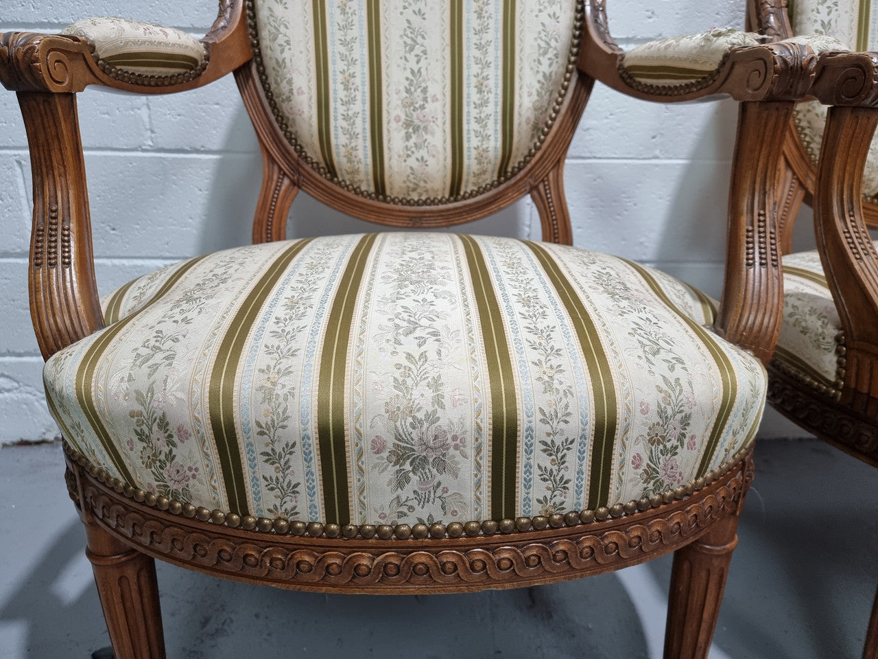Pair of French Louis XV matching carved armchairs. They are in good overall condition with some slight wear to fabric, please view photos as they help form part of the description.