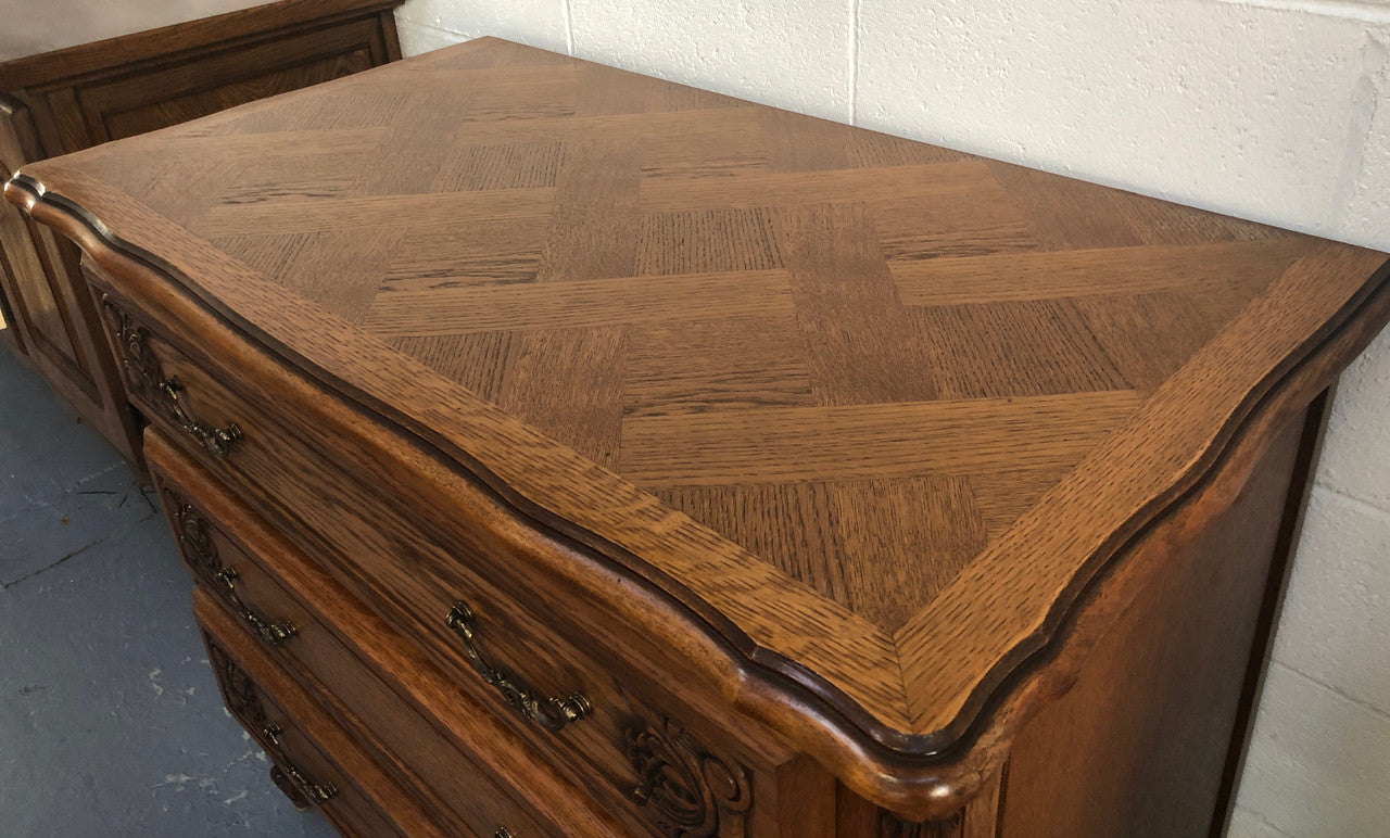 Gorgeous Provincial oak and parquetry top commode. It has beautiful carved Details and in good original detailed condition.
