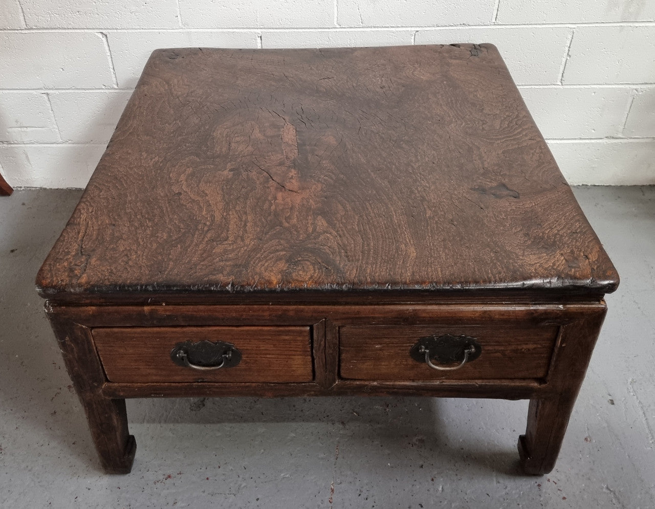 Square Elm coffee table with oriental legs and two long drawers. Beautifully finished and in good original condition. It has been sourced from France.