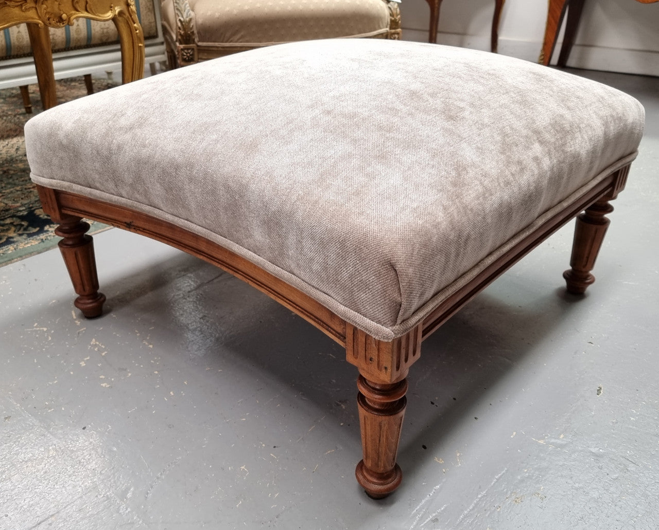 Lovely French Louis 16th style large walnut footstool with light grey upholstery. Circa:1900. In good detailed condition.