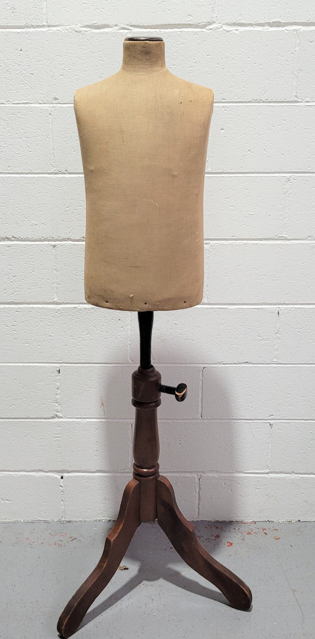 Vintage fabric covered child mannequin on adjustable wooden base. In good original condition.