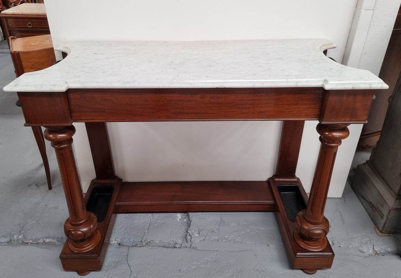 Classic Victorian mahogany console table with white marble top, one drawer and accommodation for sticks/umbrellas. In good original detailed condition.